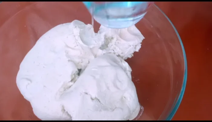Prepare the dough: Add water gradually to the masa harina dough until soft and pliable. Knead well. (72.479)