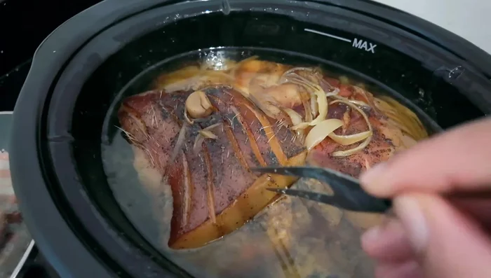 Once cooked, remove the pork from the crock pot.