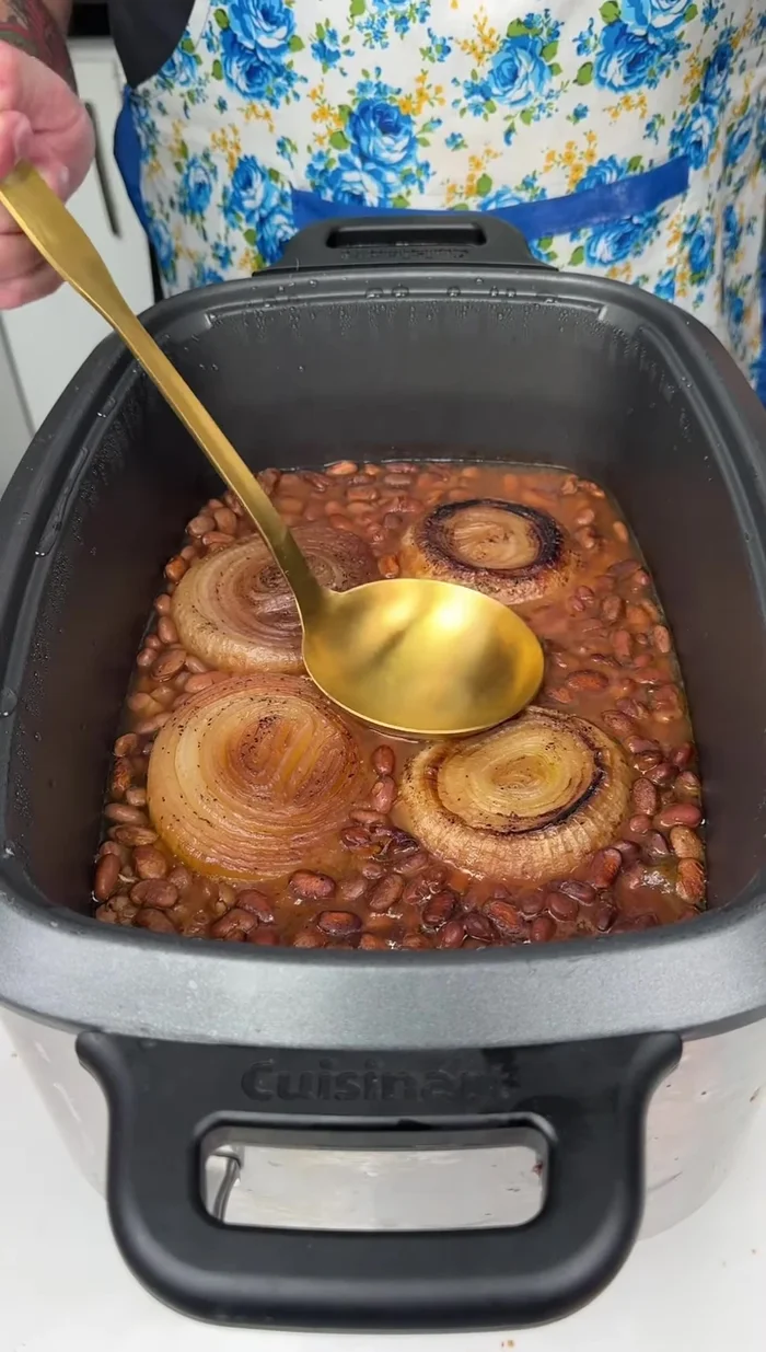 After 6 hours, remove the lid and use a ladle to remove half of the liquid.