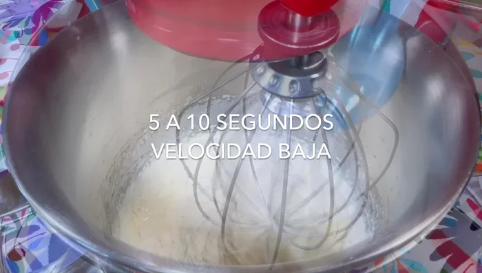Add half of the flour to the egg mixture and beat on low speed for 5-10 seconds. Add the remaining flour and beat for another 5-10 seconds, until almost combined.