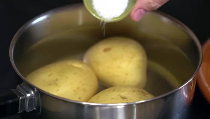 Boil potatoes with salt until tender (35-40 mins).