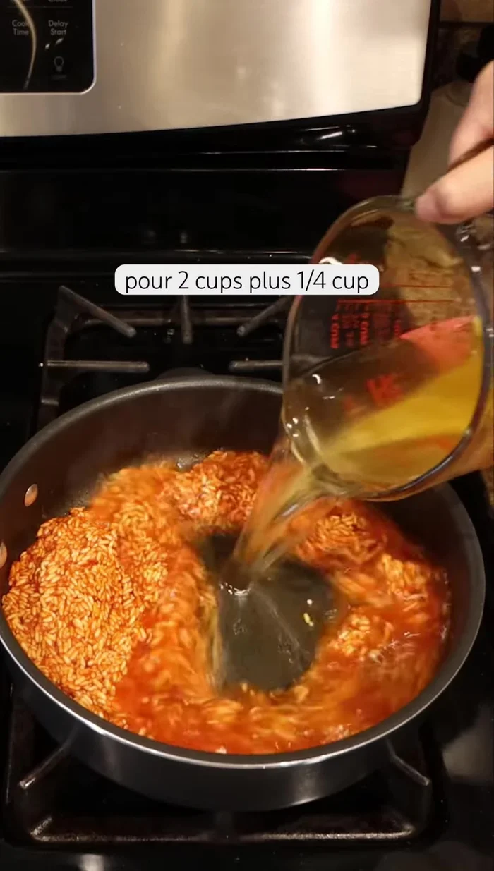 Pour in 2 1/4 cups of chicken broth, 1 teaspoon of ground cumin, 1 teaspoon of sea salt, and 1/4 teaspoon of oregano.