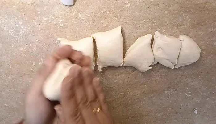 Roll out the rested dough into thin circles. Cook each tortilla briefly on a hot pan, just until lightly colored. Do not overcook.