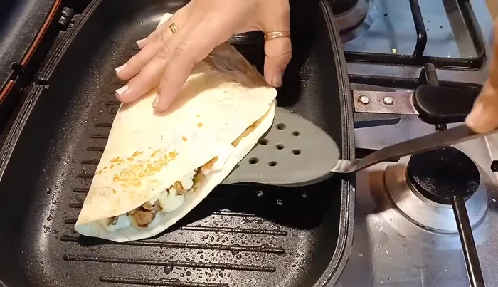 Grill the quesadillas in a lightly oiled pan for about 5 minutes per side, or until golden brown and the cheese is melted.