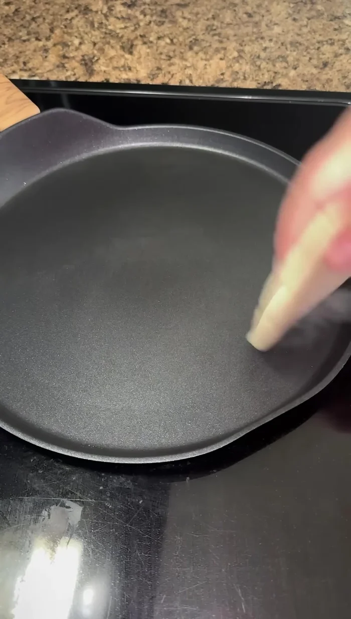 Place the gordita on a hot griddle. Cook for about a minute before flipping.