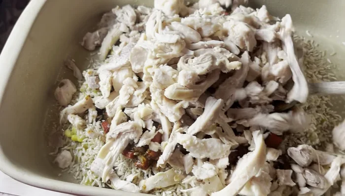 Add the shredded chicken and the remaining chicken broth. Stir well to combine.