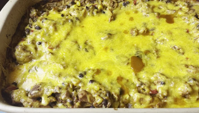 Remove foil, top with shredded cheddar cheese, and bake for another 5 minutes.