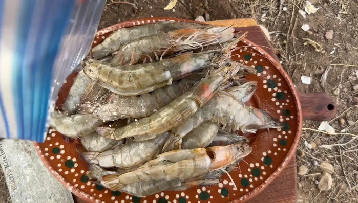 Lightly coat shrimp with flour for a crispier texture.