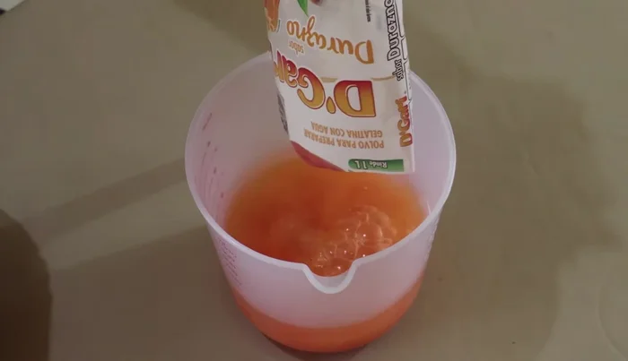 Prepare the peach gelatin: Dissolve the peach-flavored gelatin in boiling water (3 cups) until completely dissolved.
