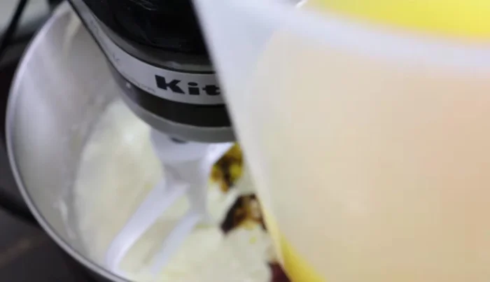 Add 2 cups of orange juice while beating.