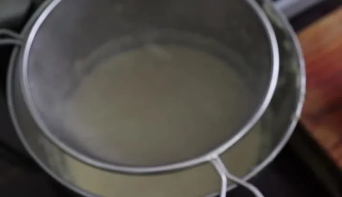 Sift 3 cups of flour and 2 tablespoons of baking powder into the mixture.