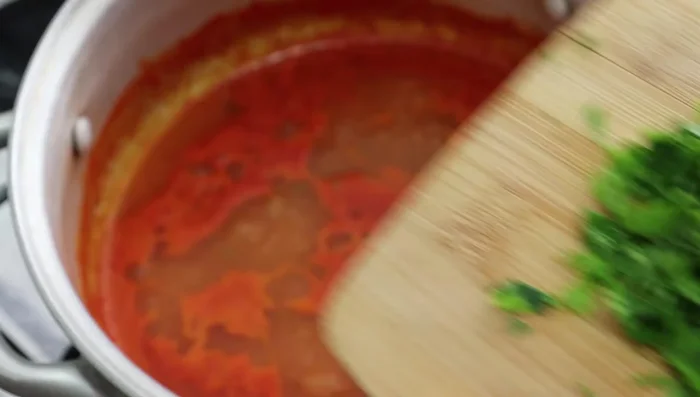 Add chopped parsley for flavor and aroma. Let it simmer for 5 more minutes.