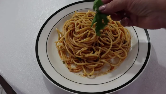 Garnish with parsley leaves and grated Parmesan cheese (or your preferred cheese).
