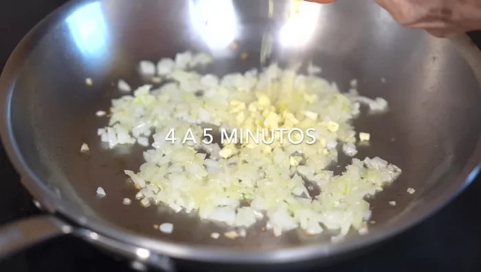 Add the garlic, bay leaf, and oregano. Cook for about a minute to release their flavor.