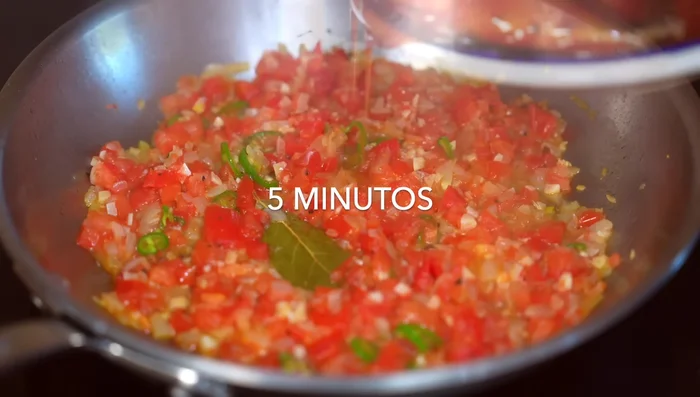 Add the sardines with their tomato sauce. Add lemon juice (or vinegar from pickled chilies) to reduce the sardine smell.