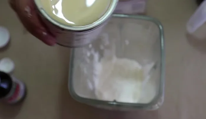 Place half cream, condensed milk, evaporated milk, vanilla extract, and regular milk into a blender.