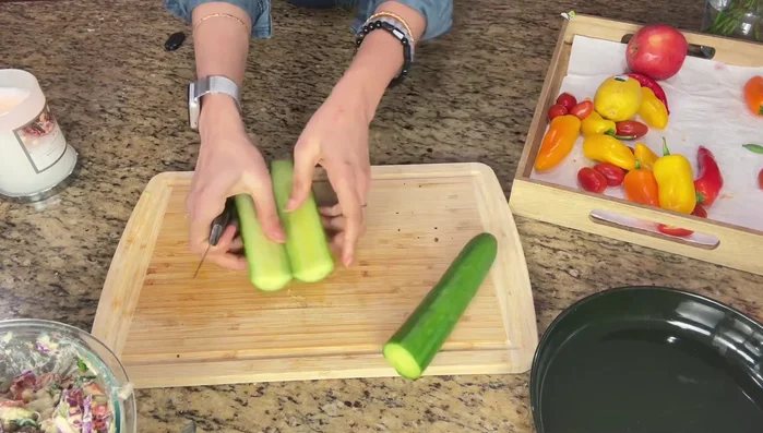Slice cucumbers in half lengthwise and scoop out seeds to create cucumber boats.