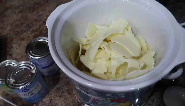 Break apart the white American and pepper jack cheese and add it to the crockpot.