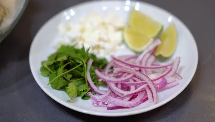 Assemble the tacos: Add the roasted mushrooms, queso fresco, pickled red onion, cilantro, and lime juice. Optional additions: sour cream and avocado.