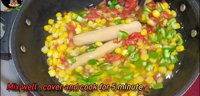 Add salt to taste and mix well. Cook with the lid on for about 5 minutes until the vegetables and sausages are cooked.