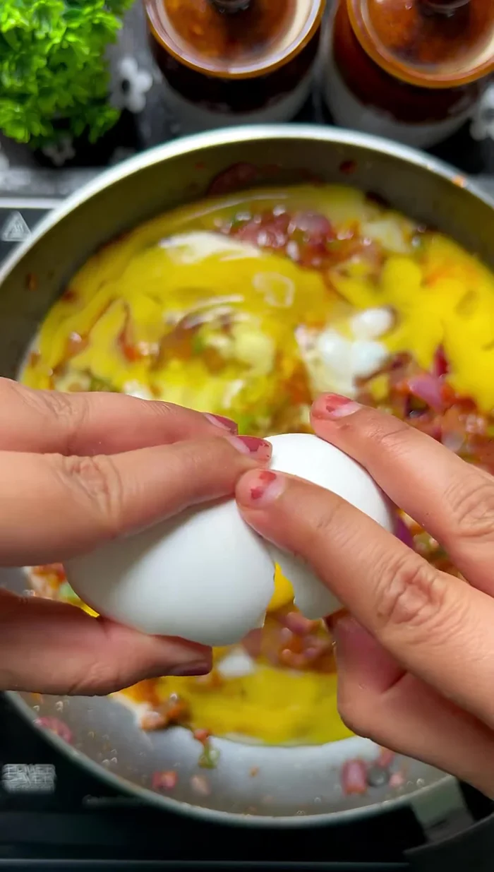 Add 5 eggs (or as desired) and scramble them, mixing with the vegetables.