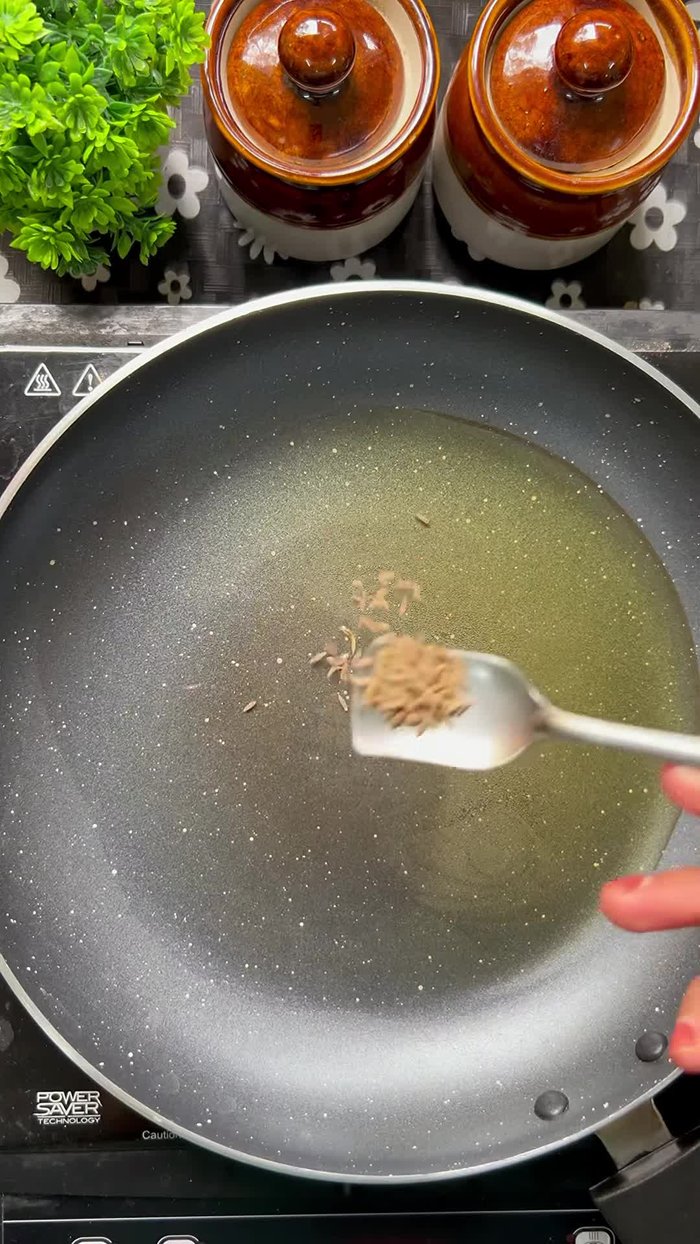 Heat oil in a pan, add ½ teaspoon cumin seeds and let it splutter for a few seconds.