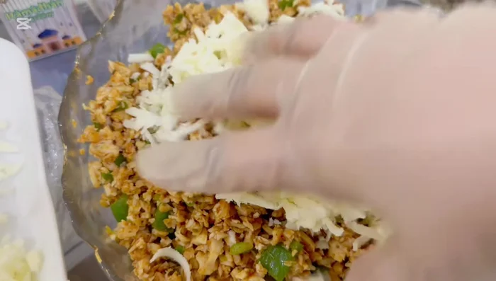 Assemble the tacos: Spread ketchup (and/or hot sauce) on a tortilla wrap. Add the shredded chicken mixture and cheese.