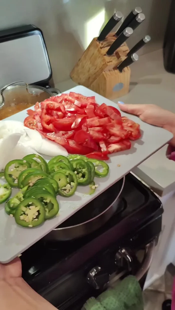 Add chopped vegetables to the pan; adjust amount of onion or chili to taste.