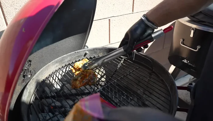 Place chicken thighs skin-side down on the direct heat zone of the grill to sear and brown.