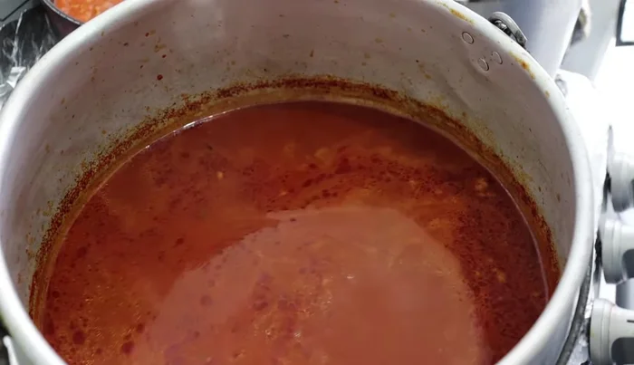 Add the cooked pork to the simmering broth and let it simmer for another 5-10 minutes.