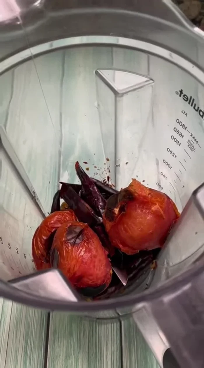 Blend roasted tomatoes, chiles, garlic, chipotle in adobo, and a cup of water to create a sauce.
