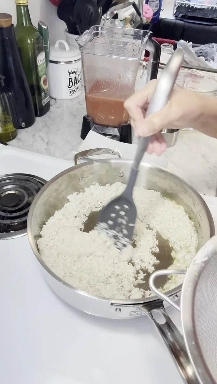 Add 3 cups of rice to the pan and fry until golden brown.