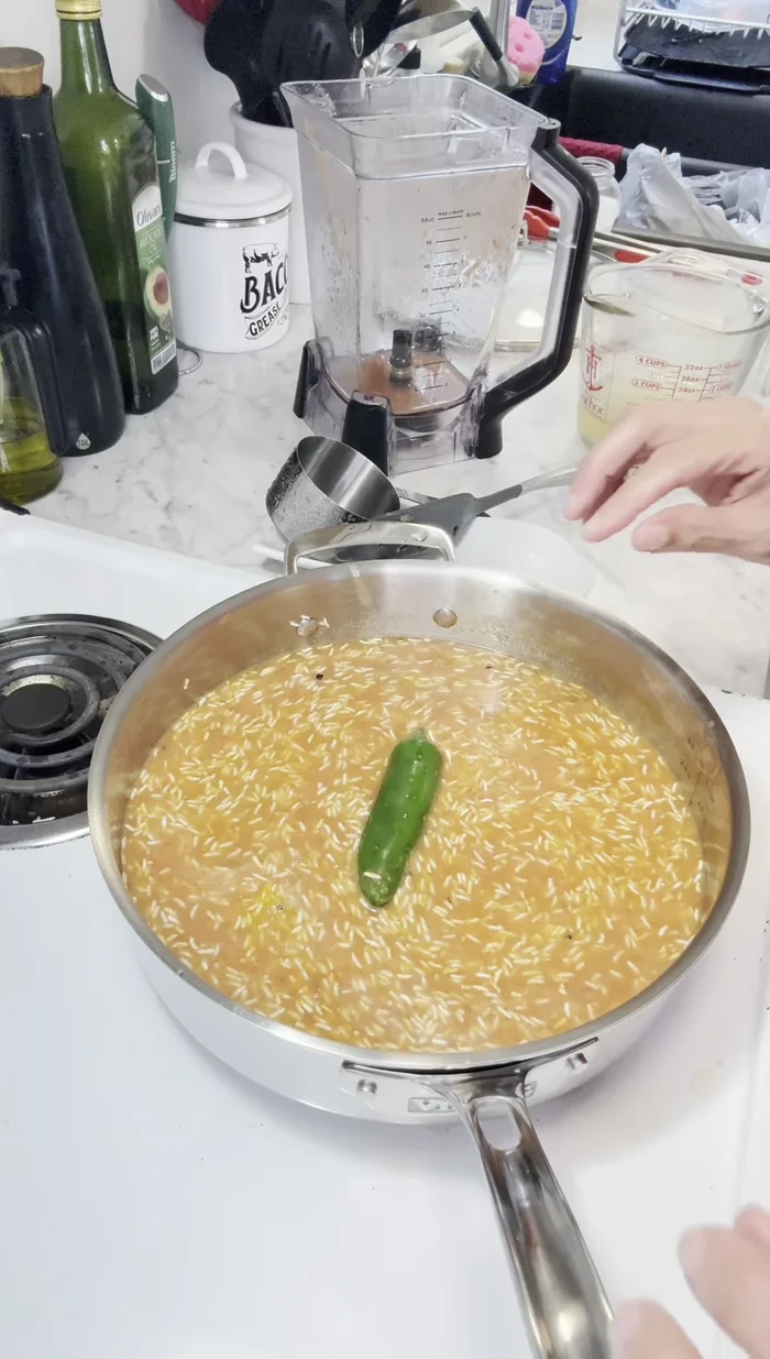 Place the jalapeno on top of the rice.