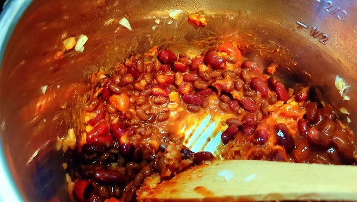 Pour in the vegetable stock. Add the chopped tomatoes on top; do not stir.