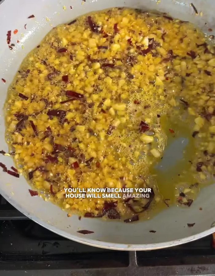 Add a pinch of salt to the pan.