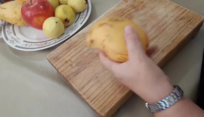 Wash and prepare all fruits. Cut one half of each fruit for blending, and chop the other half finely.