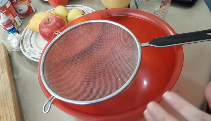 Strain the blended fruit pulp to remove seeds and solids.