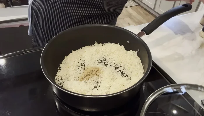 Add cumin, garlic powder, and onion powder (and optional chopped onion). Stir to combine.