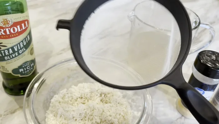 Rinse and drain 1 cup of long grain rice.