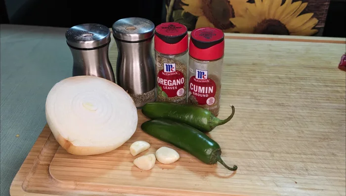 Mince half a yellow onion and two jalapenos; sauté until soft in the same pan.