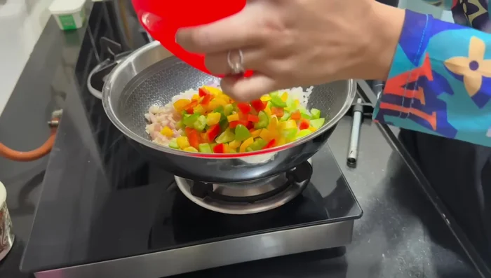 Add bell peppers, broccoli, and rajma. Sauté for a while.