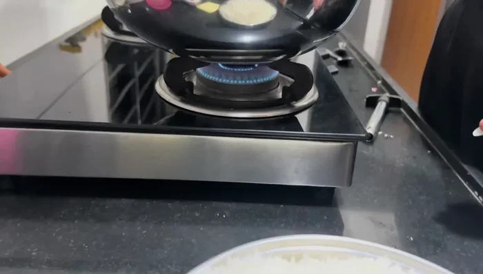 Add cooked rice, mix well and cook on low flame.