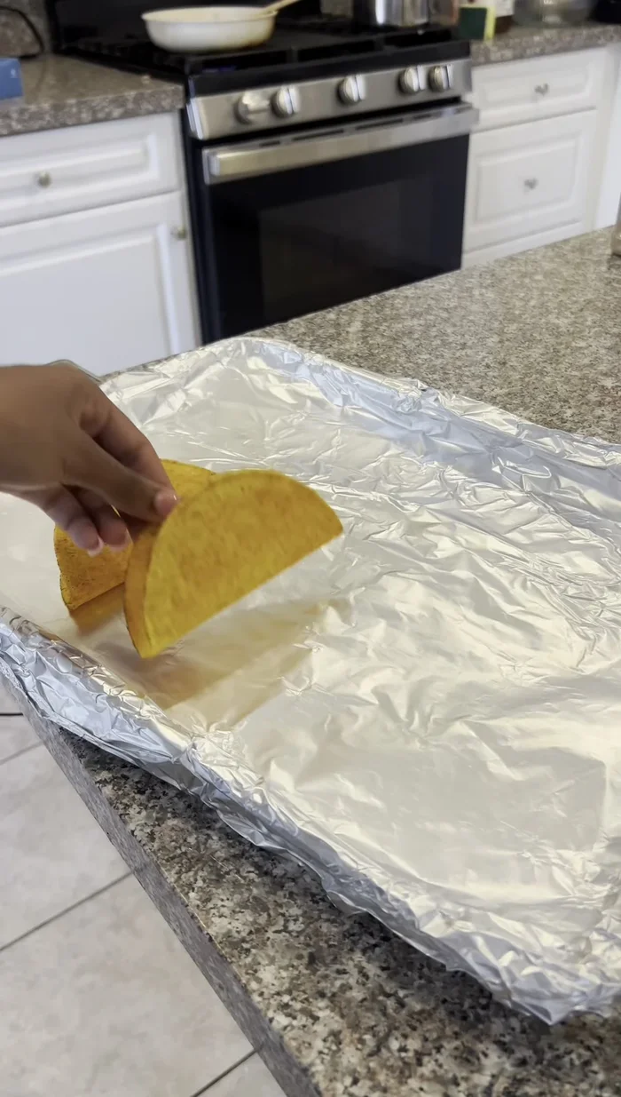 Bake taco shells at 350°F for 5 minutes.