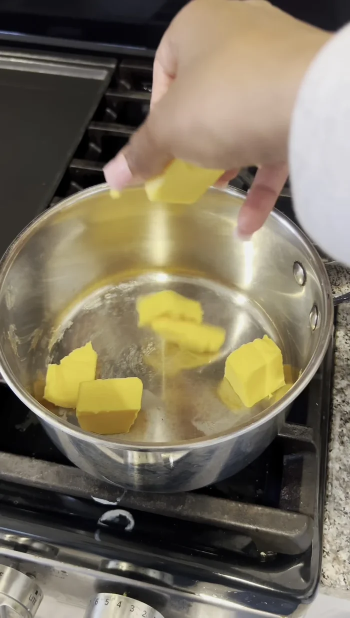 Melt Elvita cheese with a splash of milk.