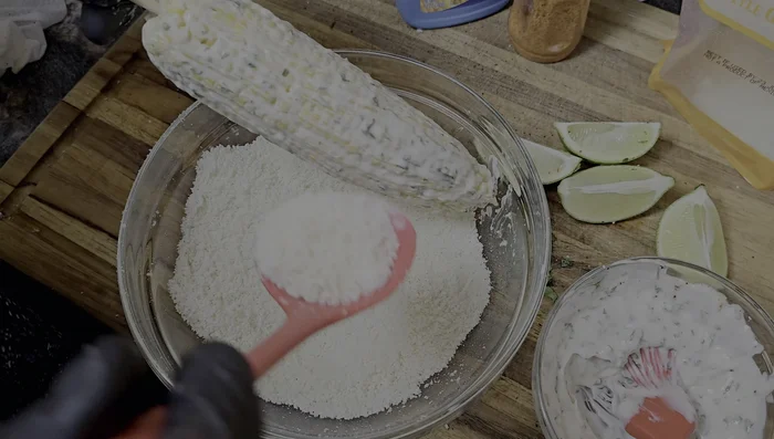 Sprinkle cotija cheese over the mayonnaise.
