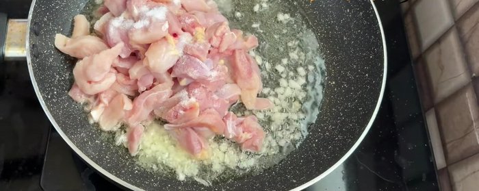 Add the washed and cut chicken strips. Cook until the color changes.