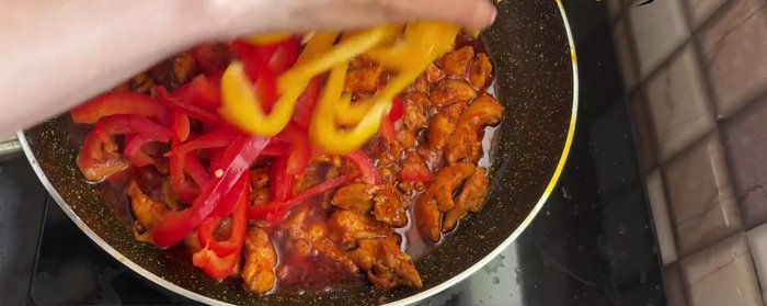 Add sliced capsicums and onions. Cook for 8-10 seconds.