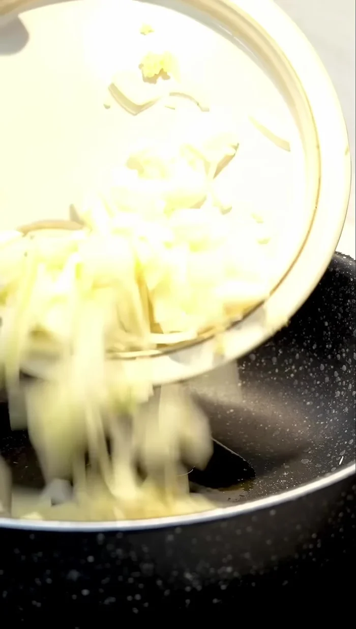 Add a little olive oil to a frying pan and brown the onion and garlic for 2 minutes.