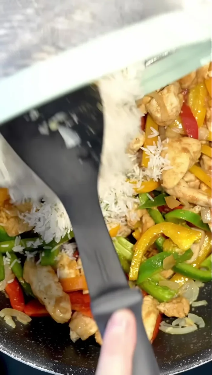 Add the rice to the chicken mixture. Pour in the boiling chicken broth and add a tablespoon of tomato paste.