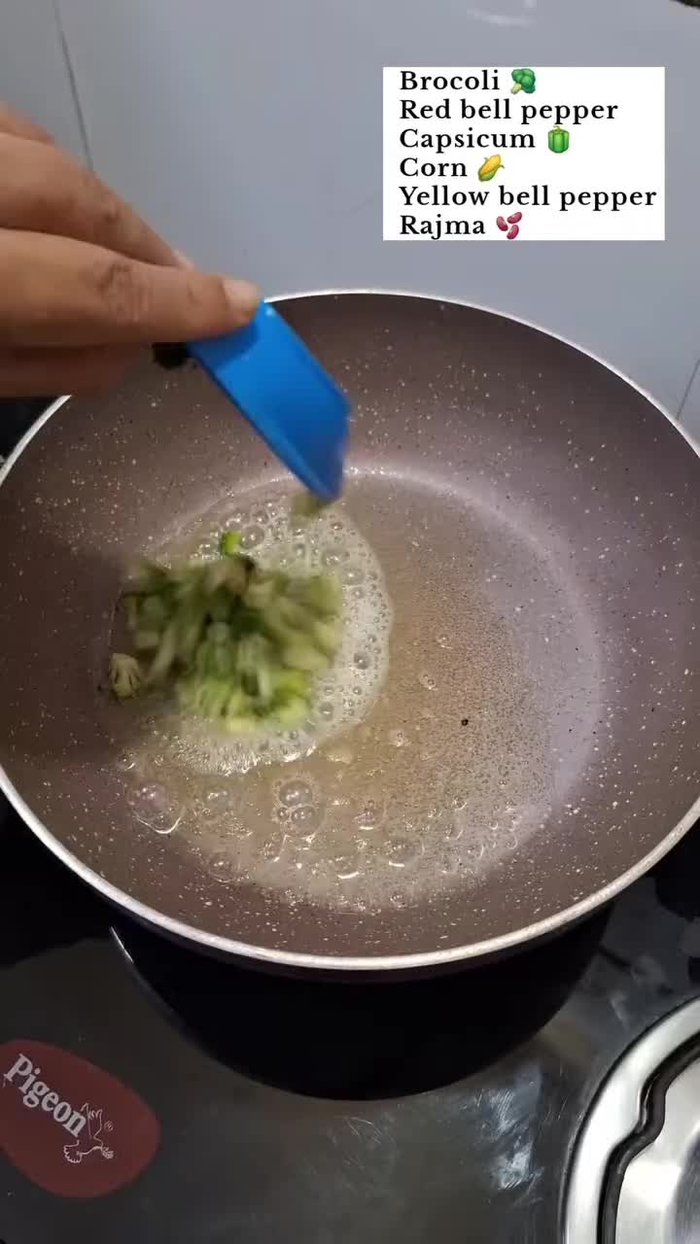 Add boiled broccoli, red capsicum, green capsicum, yellow capsicum, corn kernels, and boiled kidney beans. Mix well.